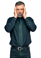 Fototapeta premium Middle age handsome man wearing business clothes suffering from headache desperate and stressed because pain and migraine. hands on head.