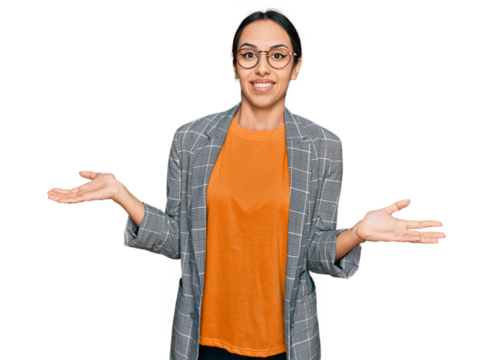 Young hispanic girl wearing business jacket and glasses clueless and confused expression with arms and hands raised. doubt concept.