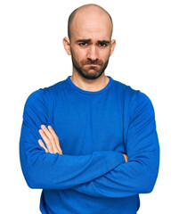 Obraz premium Young hispanic man wearing casual clothes skeptic and nervous, disapproving expression on face with crossed arms. negative person.