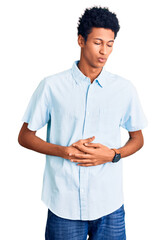 Young african american man wearing casual clothes with hand on stomach because indigestion, painful illness feeling unwell. ache concept.