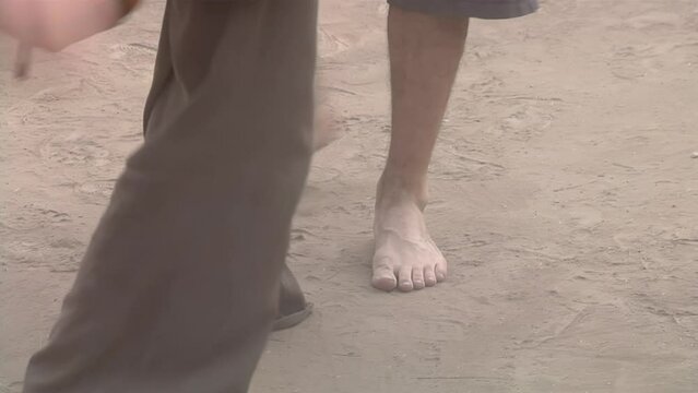 Young Couple Dancing an Argentine Folk Dance Among Crowd of People in Santiago del Estero, Argentina. Low Angle View.  