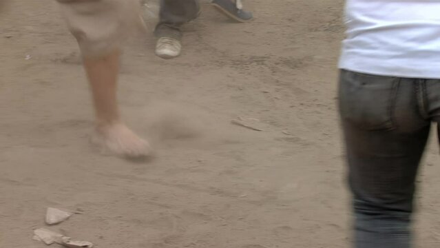 Young Couple Dancing an Argentine Folk Dance Among Crowd of People in Santiago del Estero, Argentina. Low Angle View.  