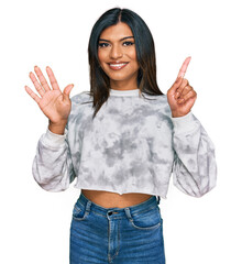 Young latin transsexual transgender woman wearing casual clothes showing and pointing up with fingers number six while smiling confident and happy.