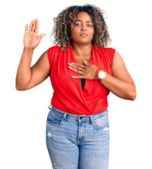 Young african american plus size woman wearing casual style with sleeveless shirt swearing with...