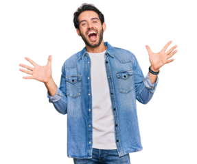 Young hispanic man wearing casual clothes celebrating crazy and amazed for success with arms raised and open eyes screaming excited. winner concept