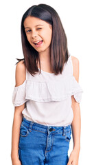 Obraz premium Beautiful child girl wearing casual clothes winking looking at the camera with sexy expression, cheerful and happy face.