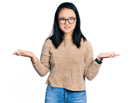 Young chinese woman wearing casual sweater and glasses clueless and confused with open arms, no idea concept.