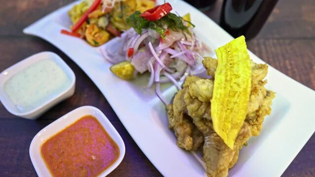 seafood trio, rice with seafood, ceviche, fish chicharon, chicha morada drink.