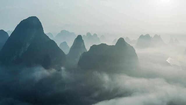 Aerial footage of Beautiful mountain with fog natural landscape at sunrise in Guilin, China. 
