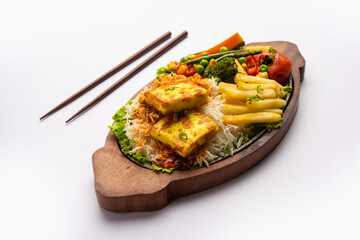 Paneer Sizzler is an Indian version with cottage cheese, salad served sizzling on hot stone dish.