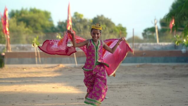 Portrait of beautiful indian girl. Young hindu woman model. Traditional India costume lehenga choli for Navaratri. young beautiful indian girl on green background