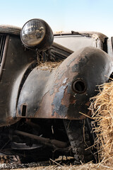 Fototapeta na wymiar Close up view of an old car wreck
