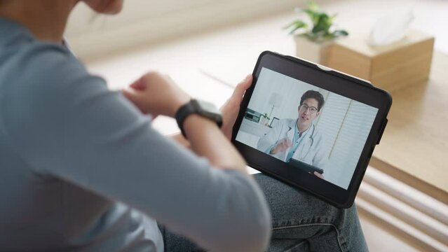 Asia woman video call talk chat help guide at home by AI tele consult telehealth telemedicine app clinic in IoT Internet of Things device collect ECG data heart pulse sleep rate on cloud computing.
