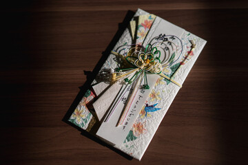 Japanese gift-money envelopes (Noshi-bukuro). Envelope for menetary gift. Japanese word translation “Happy marriage”.