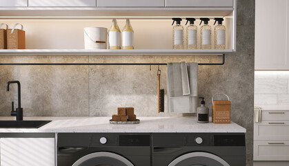 Modern interior design of laundry room with beige counter, cabinet, washing machine on black...