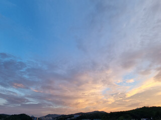 cloud and vanilla sky background with dark mountain silhouette