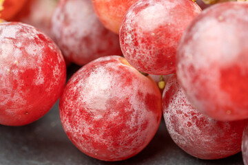 Harvest of ripe, juicy, red grapes with large berries close-up