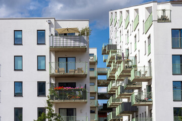 White residential building with many balconies seen in Malmö, Sweden