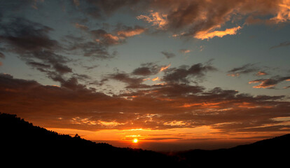 sunset sky with clouds and golden light
