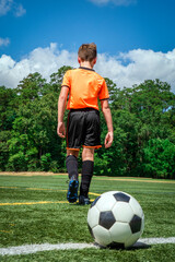 Child Youth Boy Soccer Player Walking Away From Soccer Ball © 3Days2Go Media