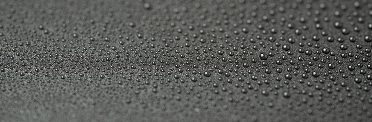 Water drops on a black background close-up