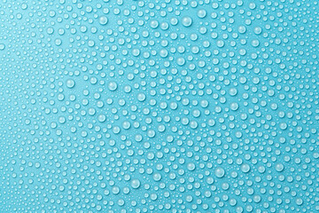 Water drops on a blue background close-up