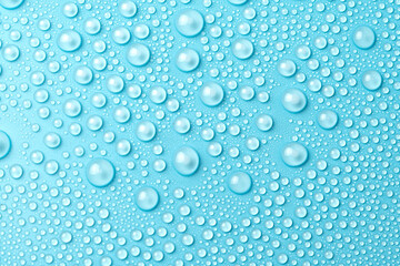 Water drops on a blue background close-up