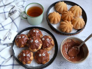 Baked pastry snacks. Spiced Cacao Coated and Uncoated Tea Cakes. Ideal for breakfast, between meals snack or Halloween party snacks