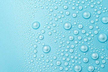 Water drops on a blue background close-up
