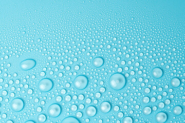 Water drops on a blue background close-up