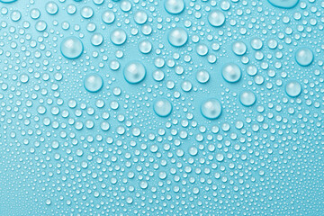 Water drops on a blue background close-up
