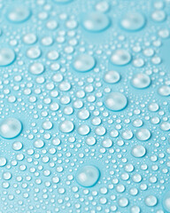 Water drops on a blue background close-up