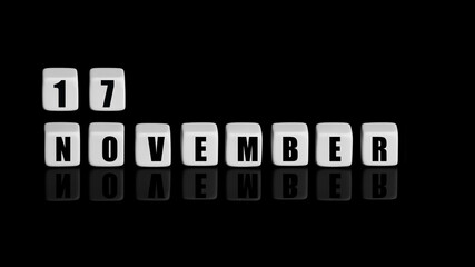 November 17th. Day 17 of month, Calendar date. White cubes with text on black background with reflection. Autumn month, day of year concept