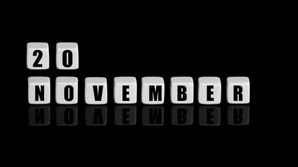 November 20th. Day 20 of month, Calendar date. White cubes with text on black background with reflection. Autumn month, day of year concept