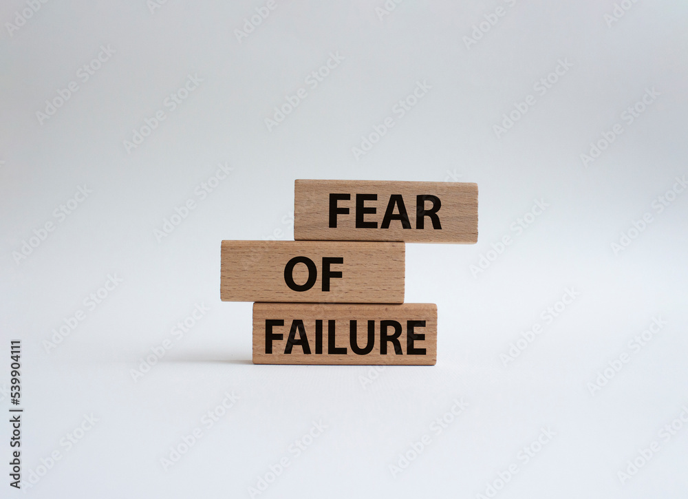 Fototapete fear of failure symbol. concept words fear of failure on wooden blocks. beautiful gwhite background.