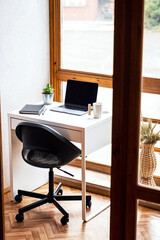 Cozy workplace on balcony. Home office space background.