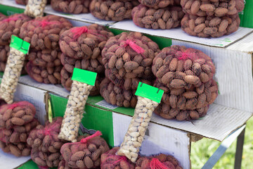 street stall selling nuts and pistachios. agriculture seeds