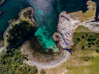 Crystal clear blue waters of Crayfish bay, New Zealand