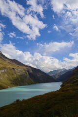 Fototapeta na wymiar Mauvoisin reservoir located in Val de Bagnes, Valais with concrete arch dam, Switzerland