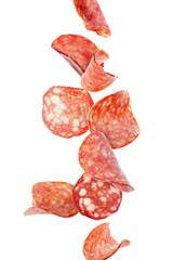 Flying slices of delicious salami isolated on white
