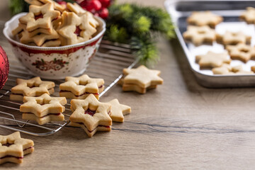 Linz Christmas cookies arranged loosely on the table