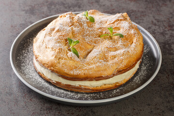 Karpatka is an easy Polish Carpathian cream cake dessert closeup on the plate on the table. Horizontal
