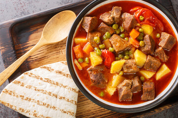 Orman Kebabı or in English Forest Kebab is one of the famous dishes of Bolu city of Turkey closeup in the bowl on the table. Horizontal top view from above