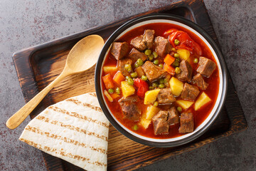 Turkish Kebap Orman Kebabi Kebab with Cubed Meat and Vegetables Stew closeup in the bowl on the table. Horizontal top view from above