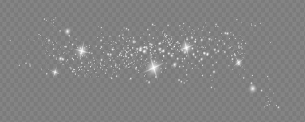 The dust sparks and golden stars shine with special light. Vector sparkles on a transparent background. Christmas light effect.