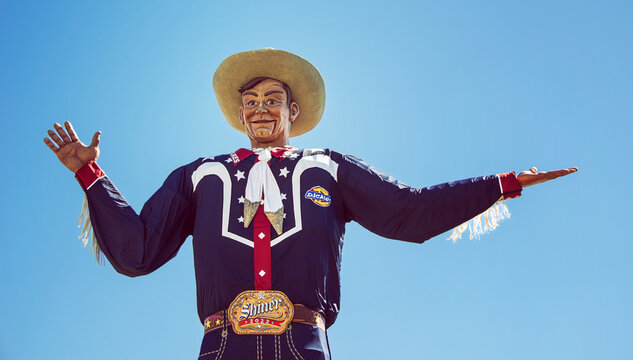Closeup of the Big Tex statue. The figure icon greets and waves his hands to welcome visitors at the State Fair of Texas fairgrounds on October 20, 2022 in Dallas, Texas.