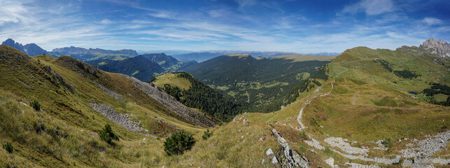 Stunning panoramic view in the dolomites: peaks at gardena valley, seceda and puez odles nature park.