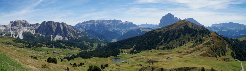 Fototapeta na wymiar Amazing panoramic view in the dolomites: from seceda alp to sella group and sassolungo group and to world famous alp de siusi. south tyrol, italy, garda valley. puez odles nature park.