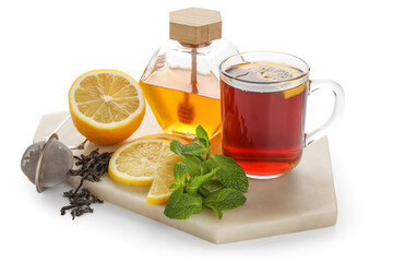 Board with glass of black tea, lemon, mint and honey on white background