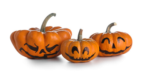 Halloween pumpkins with drawn face on white background